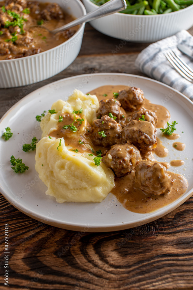 Swedish meatballs with gravy and mashed potatoes on a plate