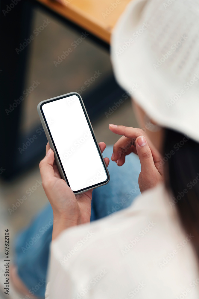 Smartphone mockup. Closeup of woman using mobile phone with empty screen at co-workspace. Smartphone mockup. Closeup of woman using mobile phone with empty screen at co-workspace.