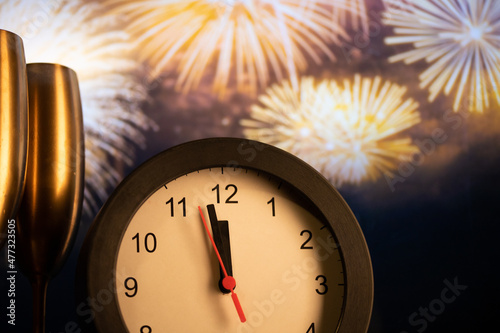 Canvas Print clock at midnight and fireworks  New Year's eve celebration