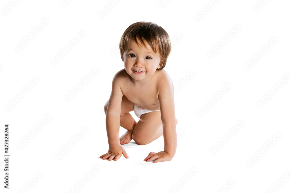 Portrait of little boy, baby, child in diaper isolated over white studio background. Childhood concept Portrait of little boy, baby, child in diaper isolated over white studio background. Childhood concept
