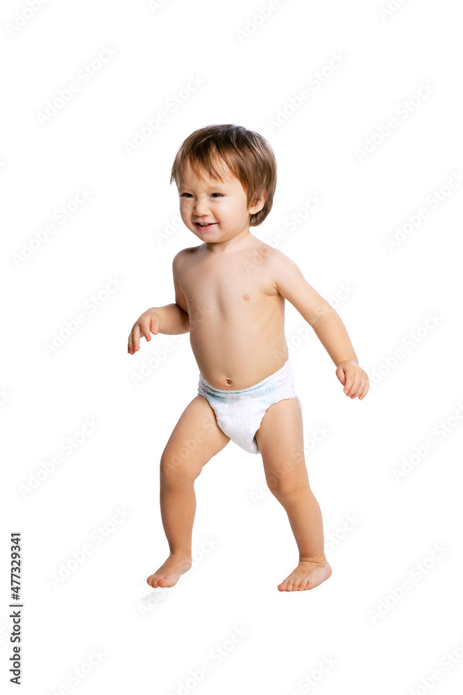 Portrait of little boy, baby, child in diaper running isolated over white  studio background. Childhood concept Stock Photo | Adobe Stock