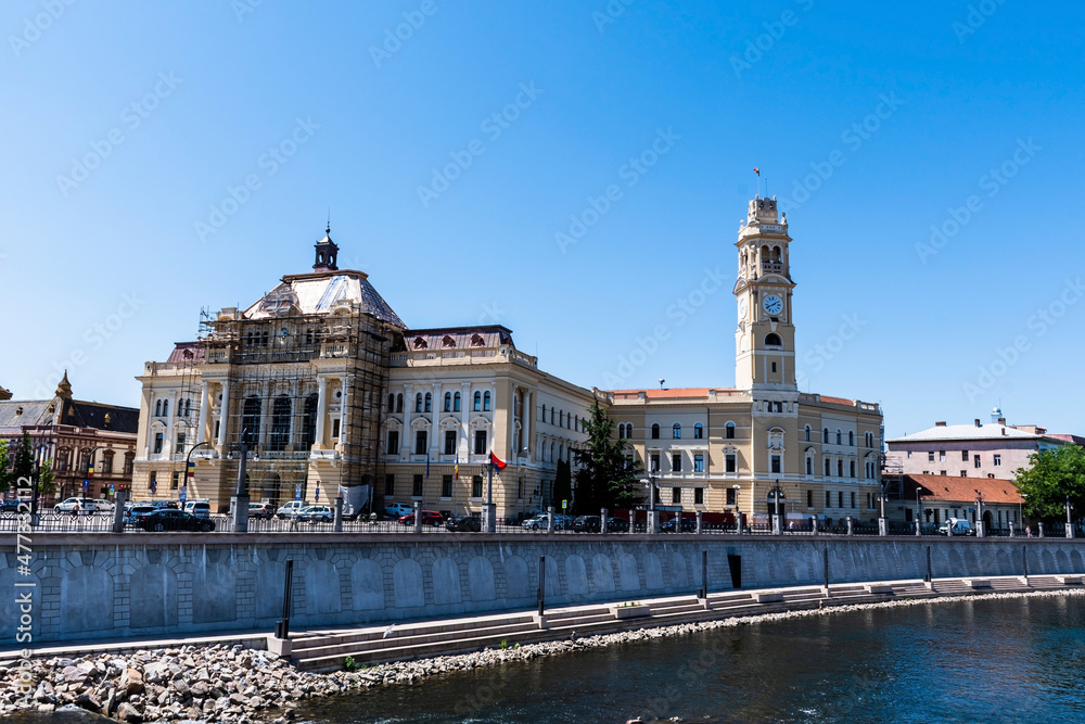 Cris river (Crisul Repede)  and the Oradea town hall. Romania.