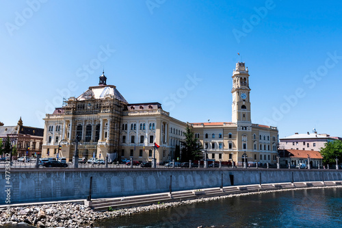 Cris river (Crisul Repede) and the Oradea town hall. Romania.