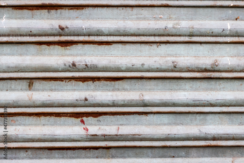 Rustic old corrugated metal sheet close up view for texture background Rustic old corrugated metal sheet close up view for texture background