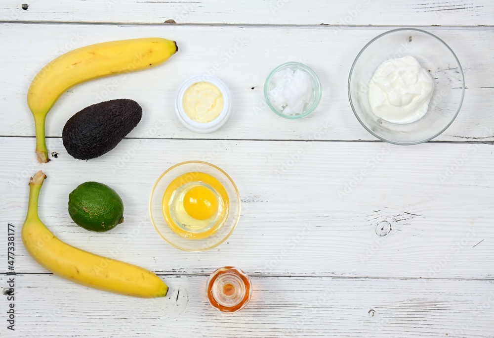Natural ingredients for smoothing, softening and hydrating your hair.  Avocado, banana, yogurt, shea butter and egg yolk for hair mask. Flat lay,  copy space. Stock Photo | Adobe Stock