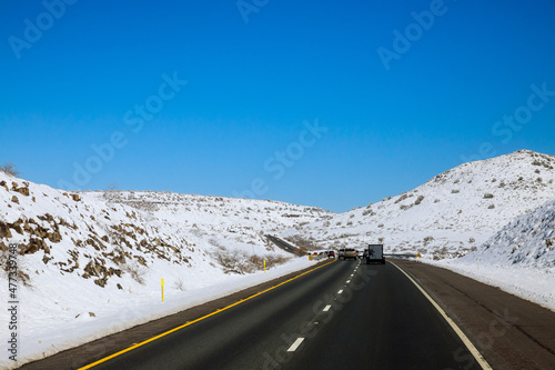 Freshly fallen snow Interstate 17 road in Arizona desert after the snowstorm