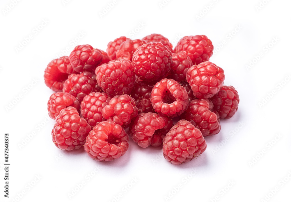 Raspberries in a plate over wooden table Raspberries in a plate over wooden table