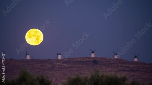 Full Moonset behind Consuegra iconic windmills