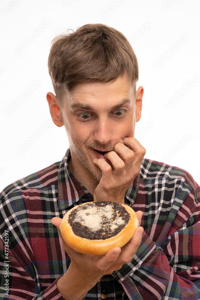 Young handsome tall slim white man with brown hair holding kolach looking very excited in flannel shirt isolated on white background Young handsome tall slim white man with brown hair holding kolach looking very excited in flannel shirt isolated on white background