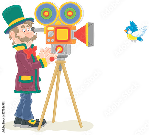 Retro filmmaker in a top hat with his old camera making a film with a flying small bird, vector cartoon illustration isolated on a white background