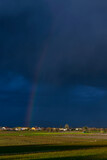 Beautiful rainbow over the Tuscan countryside near Bientina, Pisa, Italy