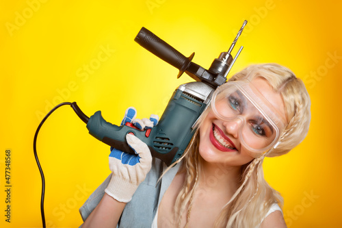 Girl with electric drill