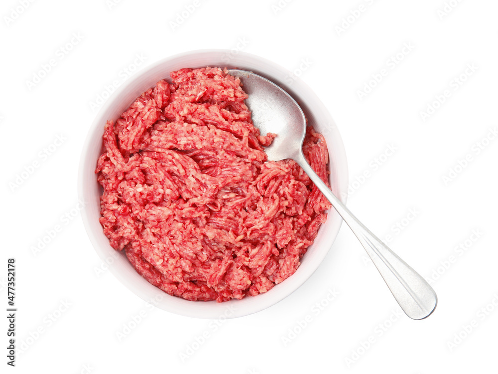 Fresh minced meat and spoon in bowl on white background, top view Fresh minced meat and spoon in bowl on white background, top view