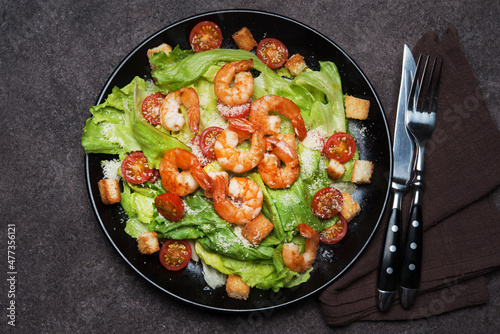 Caesar salad with shrimp, croutons and parmesan