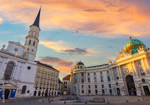 St. Michael's church and Hofburg palace on Michaelerplatz square in center of Vienna at sunrise, Austria photo