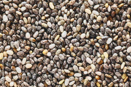 Extreme close up picture of chia seeds, selective focus, natural food background.