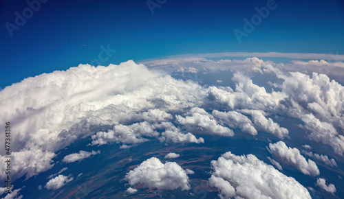 Fototapeta Naklejka Na Ścianę i Meble -  Curvature of planet earth. Aerial shot. Blue sky and clouds