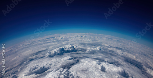 Fototapeta Naklejka Na Ścianę i Meble -  Planet Earth Curvature. Aerial shot. Blue sky and heavy clouds