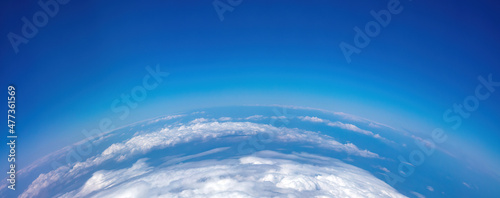 Canvas Print Curvature of planet earth. Aerial shot. Blue sky and clouds