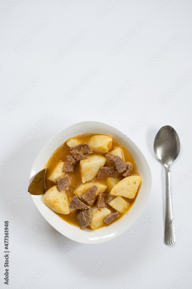 Vertical shot from above of stewed potato dish Vertical shot from above of stewed potato dish