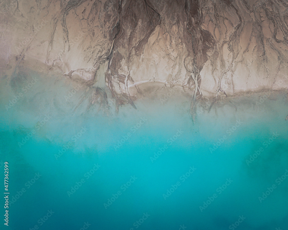 Aerial view of an abstract blue and turquoise clay lake, Art-sur-Meurthe, France. Aerial view of an abstract blue and turquoise clay lake, Art-sur-Meurthe, France.