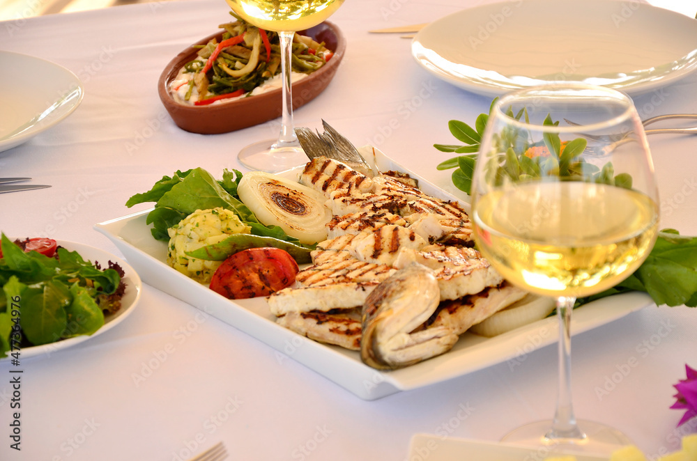 sliced sea bass with white wine and mezes