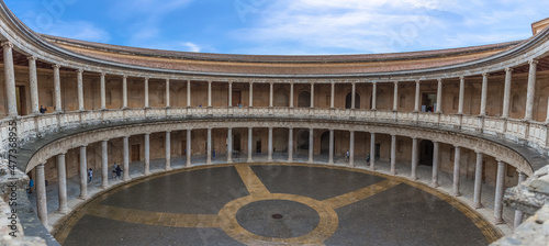 Interior circular Patio on Charles V Palace, Doric and stylized Ionic colonnade of conglomerate stone, Renaissance building located on Assabica hill, Alhambra, Granada photo