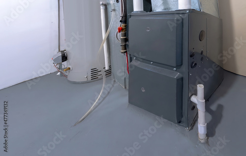 Photo A home high energy efficient furnace in a basement
