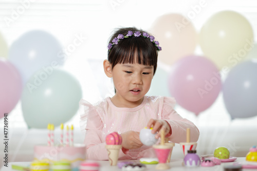 young girl pretend playing food preparing at home