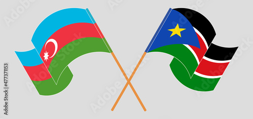 Crossed and waving flags of Azerbaijan and South Sudan