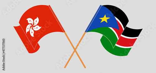 Crossed and waving flags of Hong Kong and South Sudan
