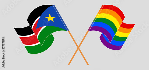Crossed and waving flags of South Sudan and LGBTQ
