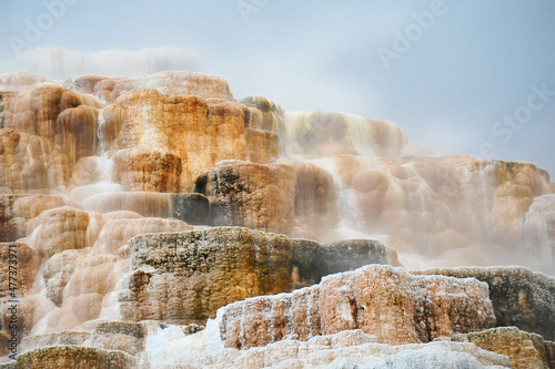 Mineral and Sandstone creates abstract staircase of color at Mammoth Hot Springs in Yellow Stone National Park, USA