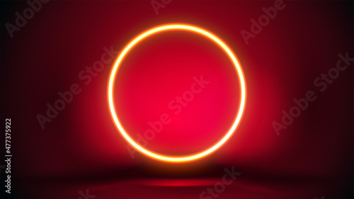 Dark red scene with large yellow neon ring.