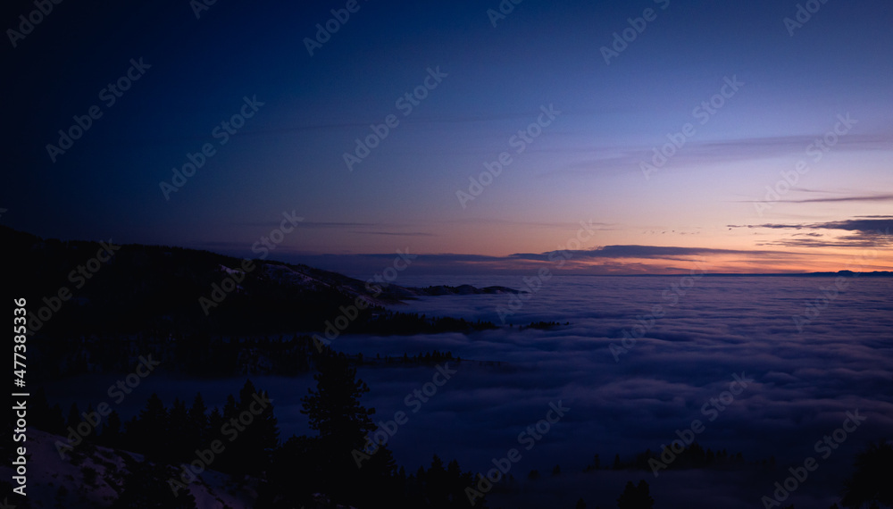 Mountain Top Sunset Above the Clouds