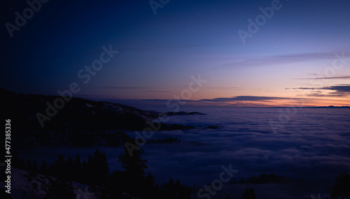 Mountain Top Sunset Above the Clouds