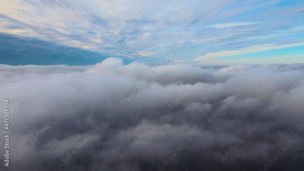 Aerial view from high altitude of earth covered with puffy rainy clouds forming before rainstorm Aerial view from high altitude of earth covered with puffy rainy clouds forming before rainstorm