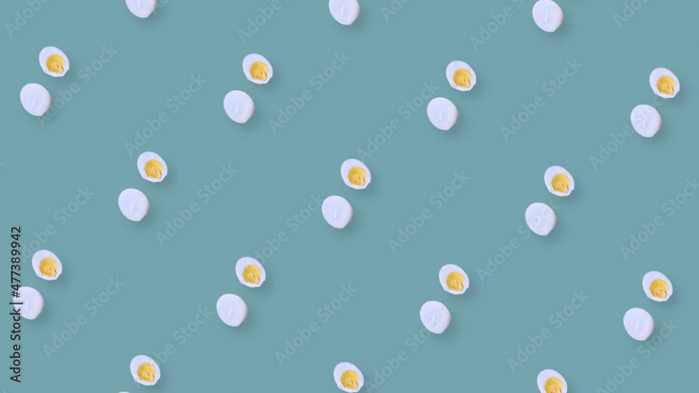 Colorful pattern of rotating chicken eggs. Pop art design. Seamless pattern with egg. Top view. Realistic animation. 4K video motion Colorful pattern of rotating chicken eggs. Pop art design. Seamless pattern with egg. Top view. Realistic animation. 4K video motion