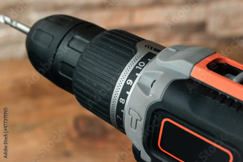 cordless screwdriver drill with battery isolated on white background in close-up detail 