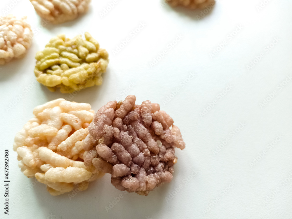 Thai sweets are arranged on white paper background. Thai fried sweet rice. Thai dressert concept. Thai sweets are arranged on white paper background. Thai fried sweet rice. Thai dressert concept.