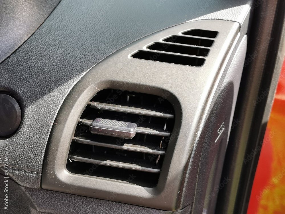 Close up interior view of the car air conditioning vent.