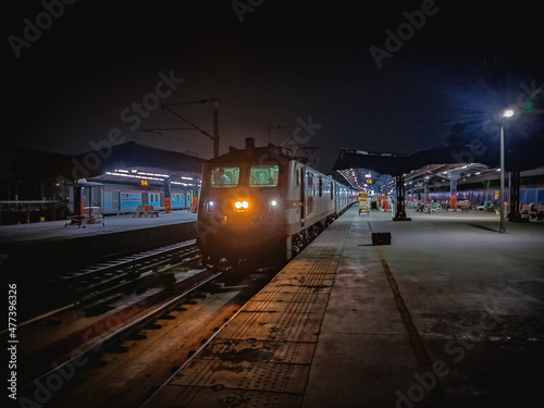 Train on rail road during night time in New Delhi, Delhi, India