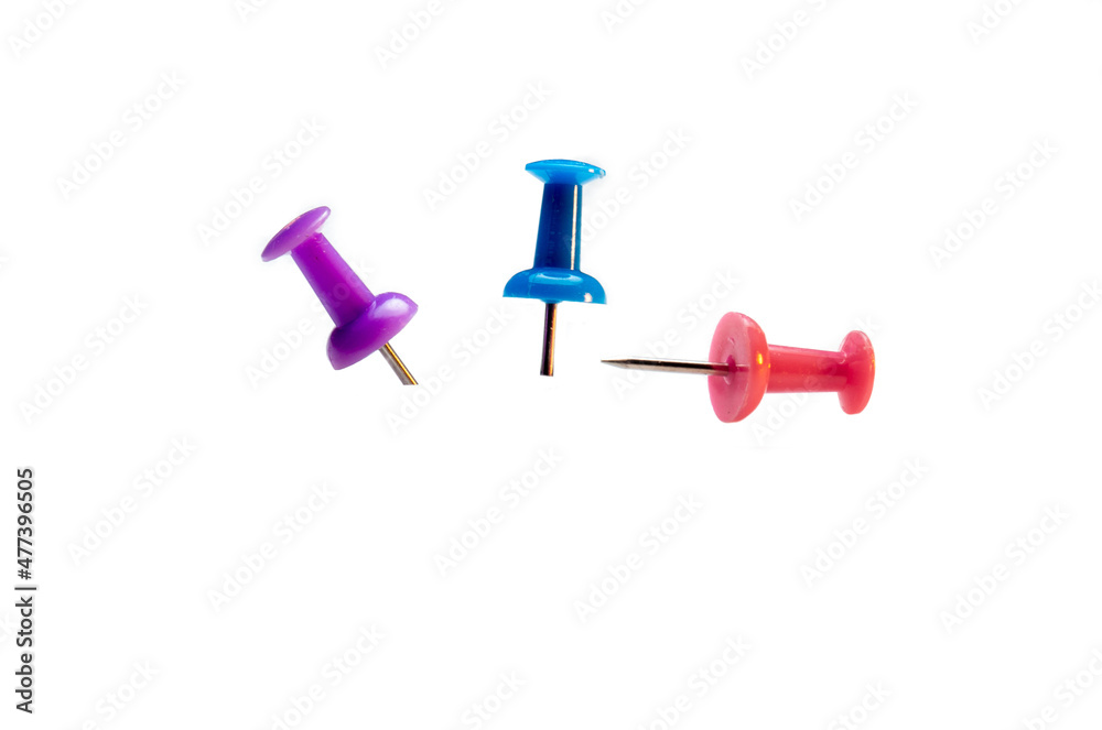colored memothumb tacks. Stationery on white background colored memothumb tacks. Stationery on white background