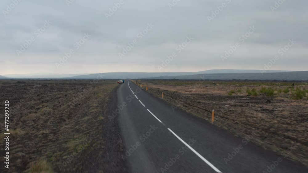 Aerial view of Ring road, most important highway in Iceland running around island. Drone view car stopped on ring road motorway. Birds eye view panoramic icelandic highlands. Wilderness concept Aerial view of Ring road, most important highway in Iceland running around island. Drone view car stopped on ring road motorway. Birds eye view panoramic icelandic highlands. Wilderness concept
