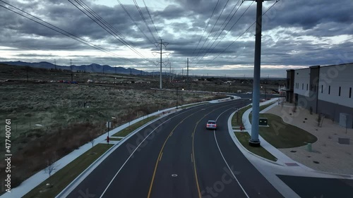 Incredible After Sunset Aerial View Following a Street at Bringhurst Station in Bluffdale Utah photo