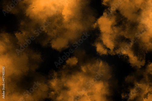 abstract explosion orange powder multicolor dust explode paint splash cloud pattern on orange.