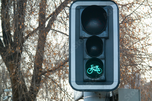 Green bike sign on a traffic light for bicycle close-up. Bikers go
