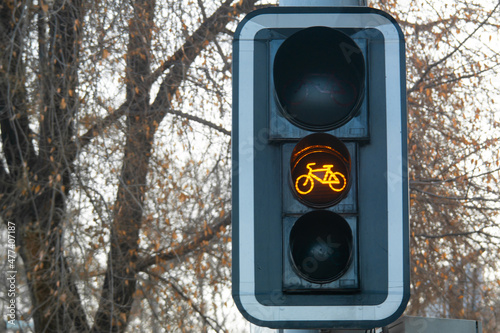 Yellow bike sign on a traffic light for bicycle close-up