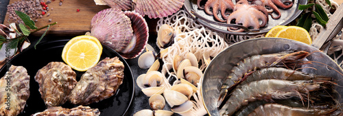 Fotografie, Obraz Fresh seafood arrangement on dark background.