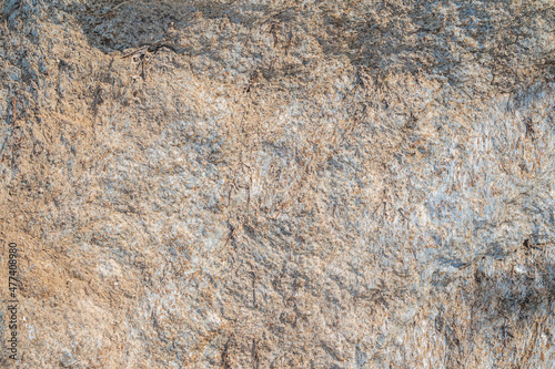 Detail of stone texture for background. Surface of the marble with brown tint